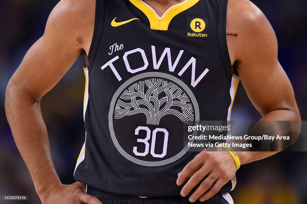 Golden State Warriors' Stephen Curry wears The Town jersey while