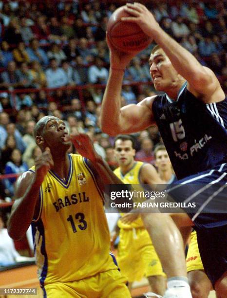 Ruben Wolkowinski of Argentina shoots the ball while Nene Hilario of Brazil tries to stop him during the final game of the Pre-World of Basketball...