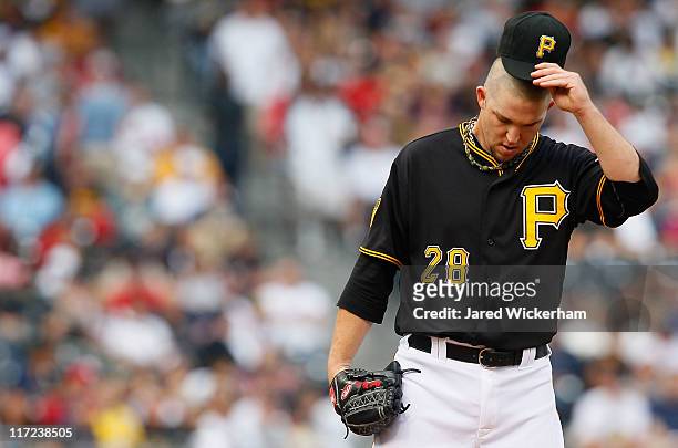 Paul Maholm of the Pittsburgh Pirates takes a moment in between pitches against the Boston Red Sox during the game on June 24, 2011 at PNC Park in...