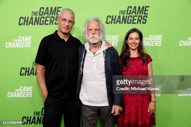 Director Louie Psihoyos, Bob Weir and Natascha Münter attend the Los Angeles Premiere of "The Game Changers" Documentary at ArcLight Hollywood on...