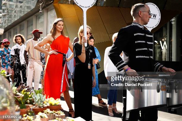 Robyn Lawley poses as models showcase designs during Pop Up 7 - Bella Unsigned Model Search at Melbourne Fashion Week on September 05, 2019 in...