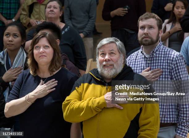 Tech pioneer, Steve Wozniak, with wife, Janet Hill, and attendees stand for the National Anthem during the installation of the official Silicon...