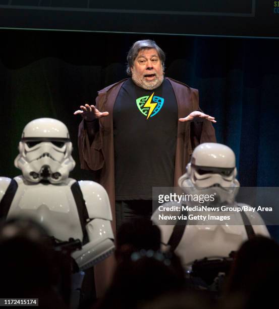 Apple co-founder Steve Wozniak addresses the crowd while being guarded by "Star Wars" Stormtroopers during the inaugural Silicon Valley Comic Con,...