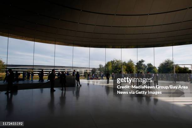 Attendees for Apple's product launch event mill in the Steve Jobs Theatre, Wednesday, Sept. 12 at Apple headquarters in Cupertino, Calif.