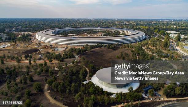 The Steve Jobs Theater, foreground, in the Apple Park campus is readied for Apple's next special event in Cupertino, California, on Thursday,...