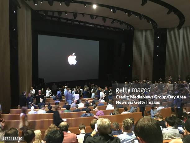 Tech journalists gather at the Steve Jobs Theater before the first-ever product launch at the new Apple Campus in Cupertino on Tuesday.