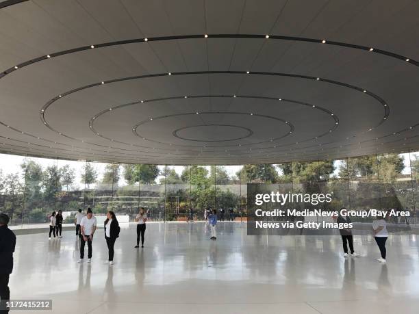 Tech journalists gather at the Steve Jobs Theater before the first-ever product launch at the new Apple Campus in Cupertino on Tuesday.