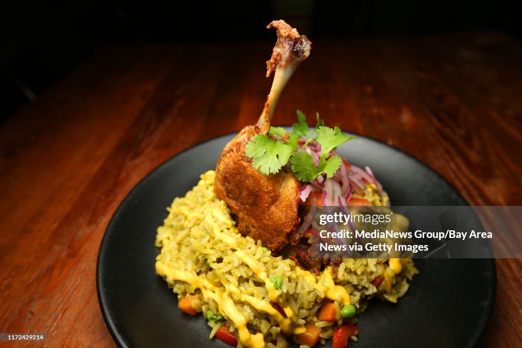 Arroz con Pato is photographed at LiMA on Tuesday, Jan. 3, 2017, in Concord, Calif. The dish consists of duck leg confit, chicha de jora, garlic, cilantro rice, and salsa criolla. (Aric Crabb/Bay Area News Group)