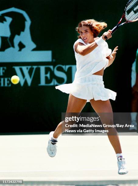 Stanford, CA July 27, 1998: Jennifer Capriati smashes a forehand during her 6-2, 6-4 victory over Mercedes Paz to qualify her for the main draw at...
