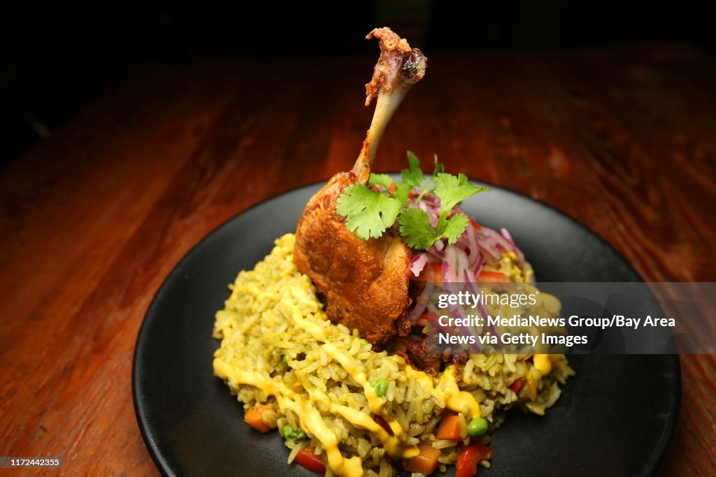 Arroz con Pato is photographed at LiMA on Tuesday, Jan. 3, 2017, in Concord, Calif. The dish consists of duck leg confit, chicha de jora, garlic, cilantro rice, and salsa criolla. (Aric Crabb/Bay Area News Group)