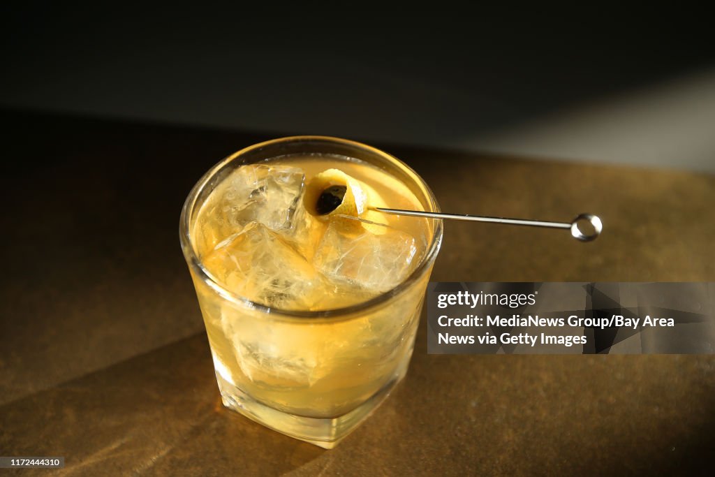 The Crazy Jutt is photographed at August 1 Five on Wednesday, Dec. 21, 2016, in San Francisco, Calif. The cocktail contains scotch, honey, apple cider vinegar, cardamom bitters, soda water, and is garnished with a cherry wrapped in lemon peel. (Aric Cra