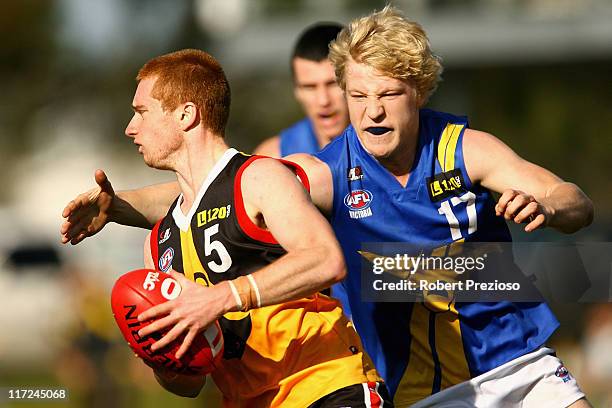 Alex Benbow of the Stingrays runs with the ball during the round 10 TAC Cup match between Dandenong Stingrays and the Western Jets at Shepley Oval on...