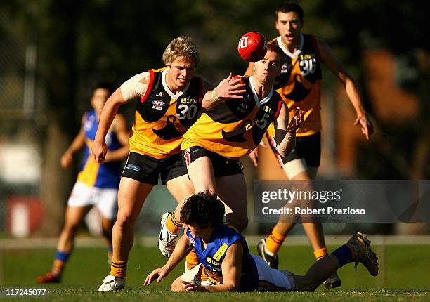 Alex Benbow of the Stingrays gathers the ball during the round 10 TAC Cup match between Dandenong Stingrays and the Western Jets at Shepley Oval on...
