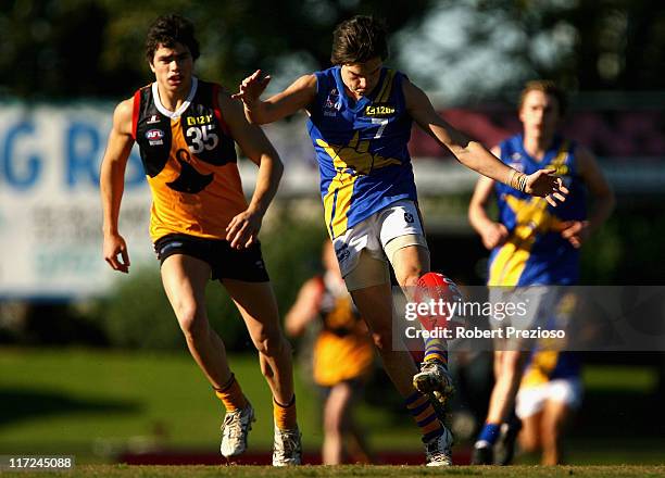 Jordan Mead of the Jets kicks on the run during the round 10 TAC Cup match between Dandenong Stingrays and the Western Jets at Shepley Oval on June...