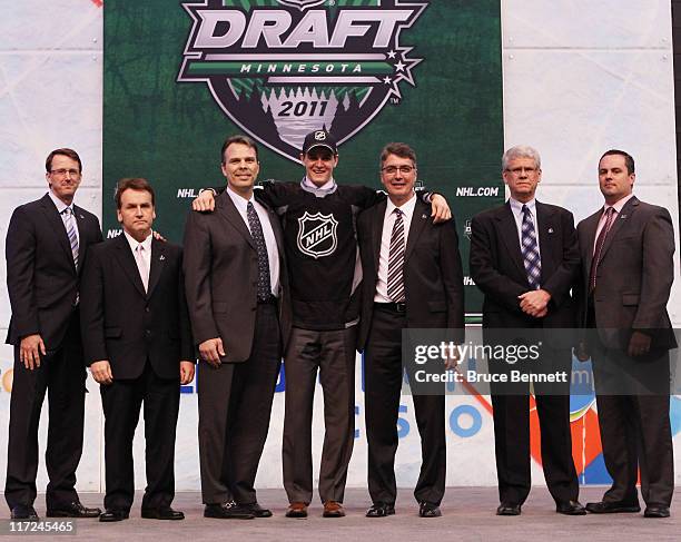 Seventh overall pick Mark Scheifele by the Winnipeg Jets stands at the podium for a photo with members of the Winnipeg Jets organization during day...