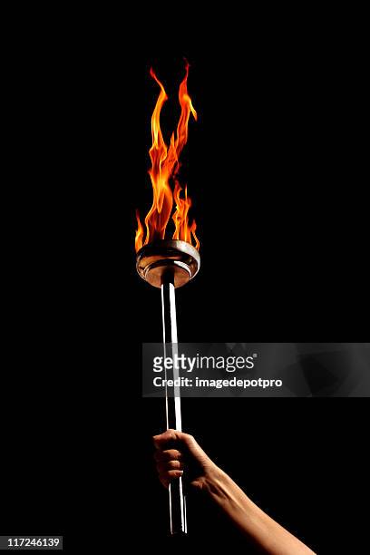 flaming torch - torch flame stock pictures, royalty-free photos & images