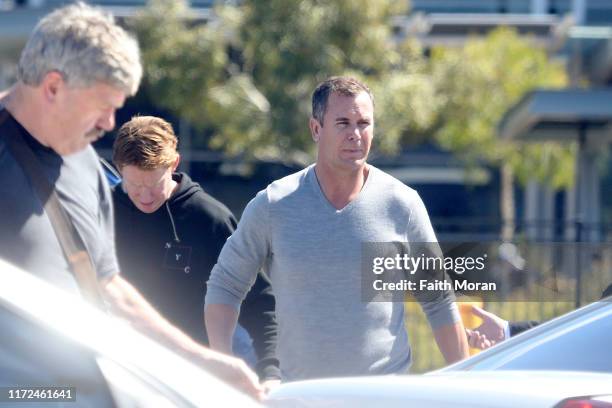 Wayne Carey, Cameron Ling and Brian Taylor are seen arriving at Perth Airport on September 5, 2019 in Perth, Australia.