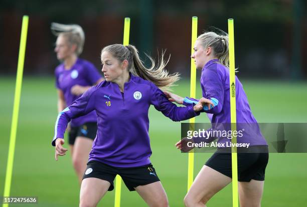 Janine Beckie and Gemma Bonner of Manchester City Women during a training session at Manchester City Football Academy on September 05, 2019 in...