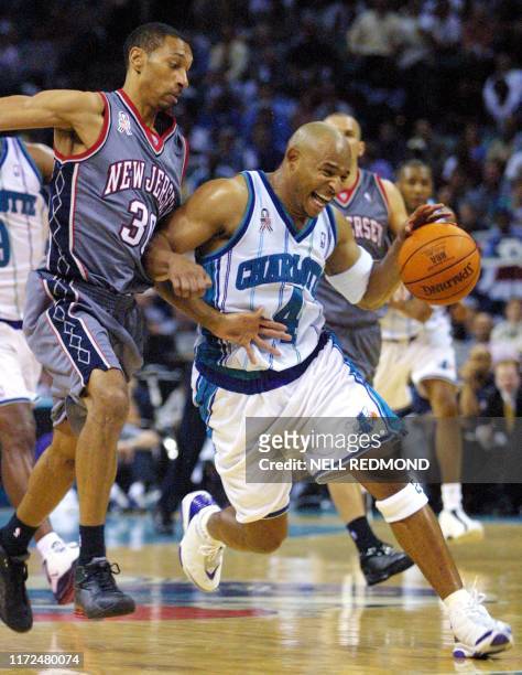 Charlotte Hornets' guard David Wesley drives past New Jersey Nets' guard Kerry Kittles in the second half of round two, game three, in the Eastern...