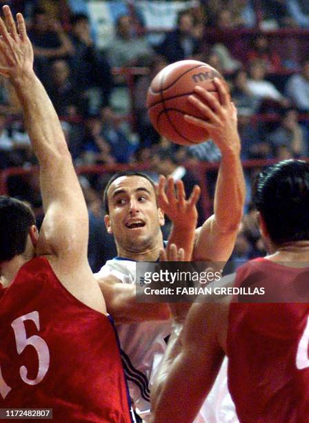Emanuel Ginobili shoots the ball past his Puerto Rican opponents during a game in the Ruca-Che Stadium in Neuquen, Argentina on August 24, 2001 at...