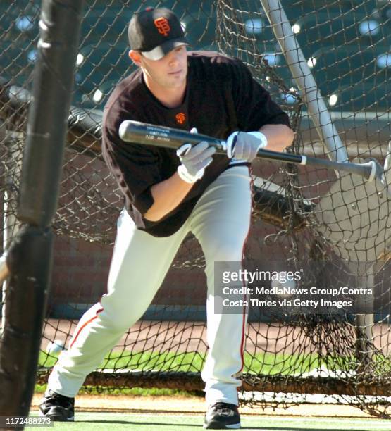 San Francisco Giants pitcher Noah Lowry bunts the ball during batting practice before the start of their baseball game against the Washington...