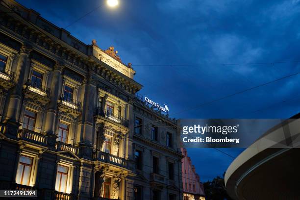 Credit Suisse logo stands illuminated on the roof of the Credit Suisse Group AG headquarters at night in Zurich, Switzerland, on Sunday, Sept 29,...