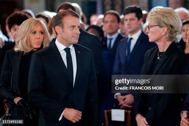 Claude Chirac , daughter of late French President Jacques Chirac, looks at French President Emmanuel Macron and his wife Brigitte, during a church...