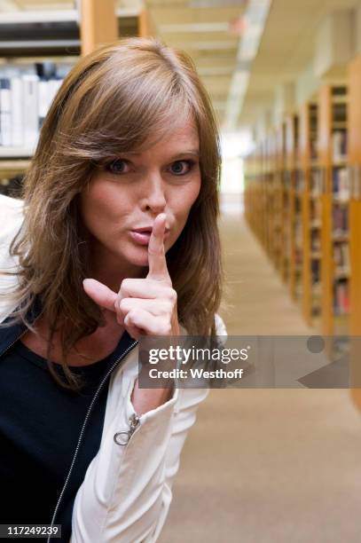 Library Shushing Sign 50 Librarian Shushing Stock Photos, High-Res Pictures, and Images ...
