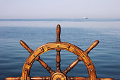 Steering hand wheel ship on sea background