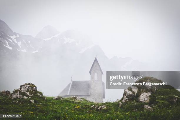 fog in the alpine village of merglisalp, canton appenzell, switzerland - appenzell innerrhoden stock pictures, royalty-free photos & images