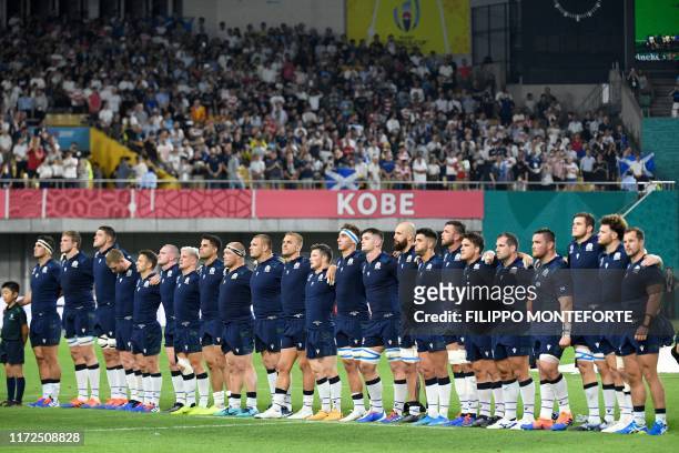 Scotland's players line up prior to the Japan 2019 Rugby World Cup Pool A match between Scotland and Samoa at the Kobe Misaki Stadium in Kobe on...