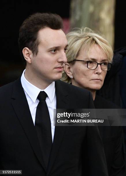 France's former President Jacques Chirac's daughter Claude Chirac arrives with her son Martin Rey-Chirac to attend a church service for former French...