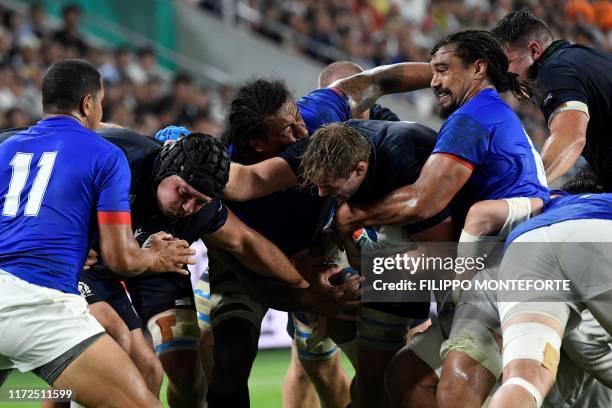 Scotland's lock Jonny Gray is tackled by Samoa's flanker Chris Vui during the Japan 2019 Rugby World Cup Pool A match between Scotland and Samoa at...