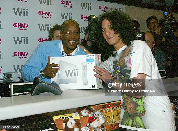 Ian Wright serves first customer with the Nintendo Wii