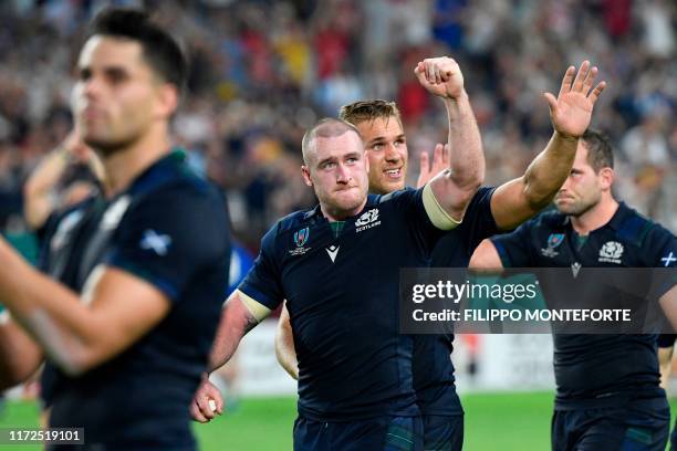 Scotland's full back Stuart Hogg celebrates with Scotland's centre Chris Harris after winning during the Japan 2019 Rugby World Cup Pool A match...