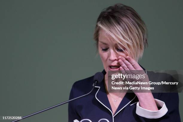 Actress Sharon Stone wipes her tears as she reads excerpts of the letter "Emily Doe" wrote to former Stanford swimmer Brock Turner, on Friday, Nov....