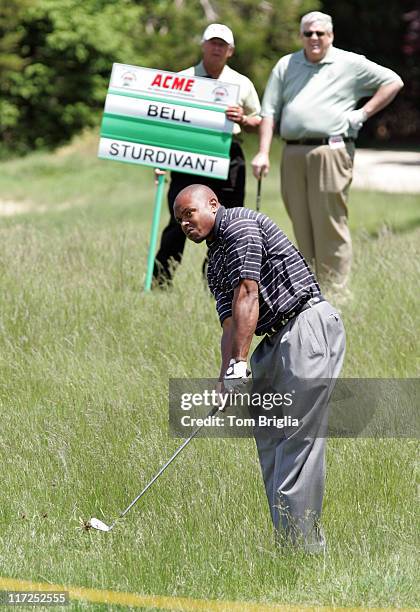 All Pro Middle Linebacker from the World Champions Tampa Bay Buccaneers Shelton Quarles hits from the tall grass during action at the Ron Jaworski...