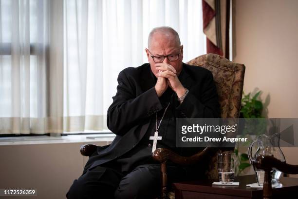 Cardinal Timothy Dolan, Archbishop of New York, attends a news conference regarding the response to sexual abuse of minors within the New York...