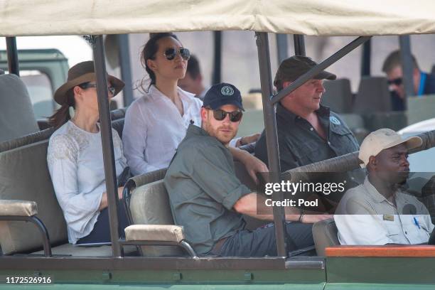 Prince Harry, Duke of Sussex arrives by safari jeep to watch an anti-poaching demonstration exercise conducted jointly by local rangers and UK...