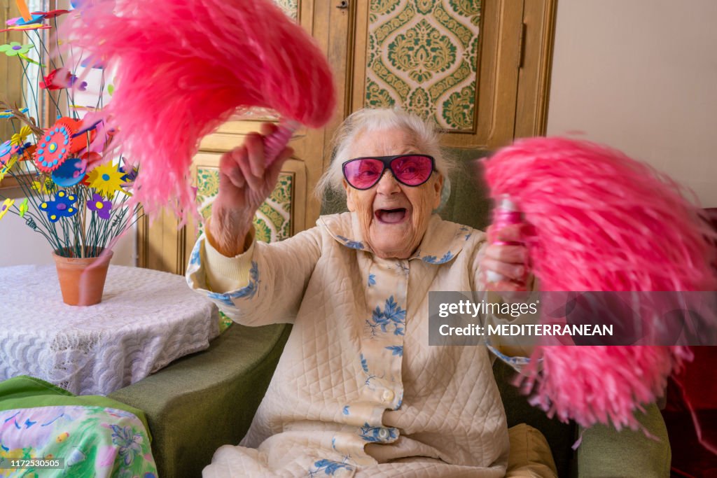 Cheerleader pom-pom elderly woman happy