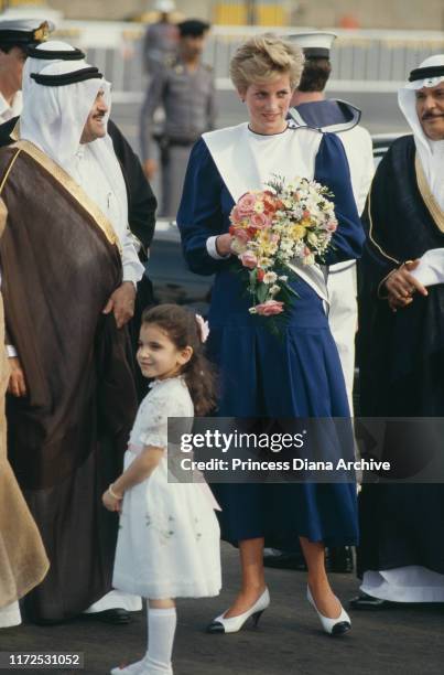 Diana, Princess of Wales wearing a blue Anouska Hempel dress upon her arrival in Jeddah, Saudi Arabia, 17th November 1986.