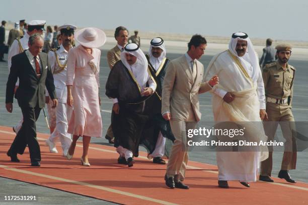 Diana, Princess of Wales and Prince Charles are met by Crown Prince Sheikh Hamad bin Khalifa Al Thani upon their arrival in Doha, Qatar, 14th...