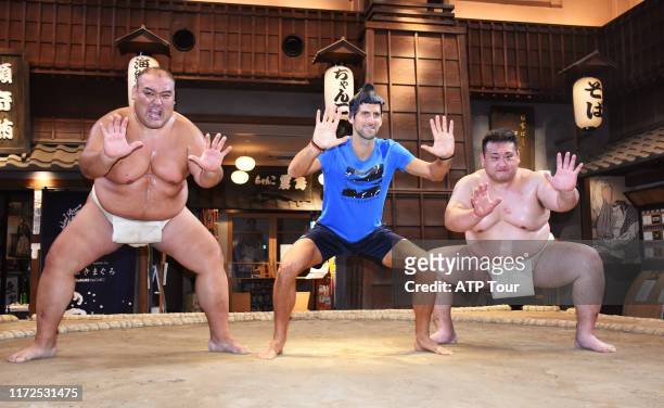 Novak Djokovic works out with sumo wrestlers at the Ryogoku Edo-Noren on September 30, 2019 in Tokyo, Japan. The World No. 1 watched wrestlers during...