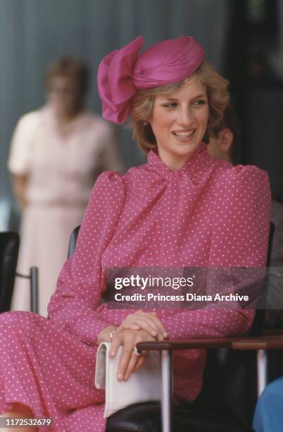 Diana, Princess of Wales wearing a pink Donald Campbell suit and a John Boyd hat at the Perth Hockey Stadium in Bentley, Australia, 7th April 1983.