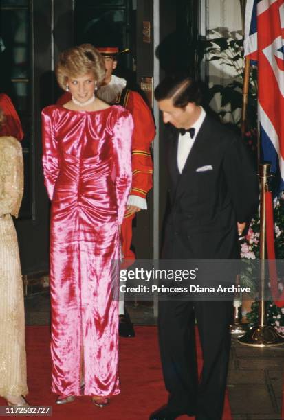 Prince Charles and Diana, Princess of Wales attend a dinner in Palm Beach, Florida, USA, November 1985. Diana is wearing a pink evening gown by...
