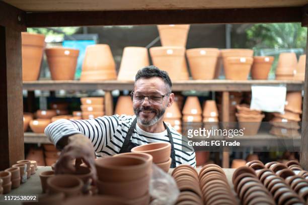 portrait of florist small business flower shop owner - plant nursery stock pictures, royalty-free photos & images