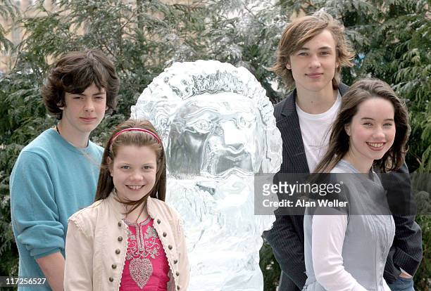 Skandar Keynes, Georgia Henley, William Moseley and Anna Popplewell alongside a lifesize ice sculpture of Aslan.