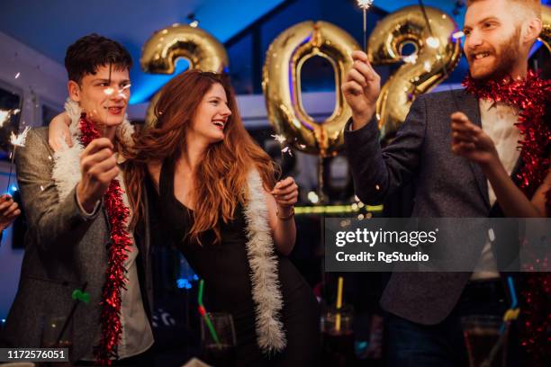 couples celebrating new year's eve - 2020 2029 stock pictures, royalty-free photos & images