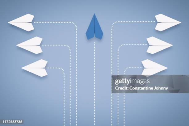 paper airplane different approach and leadership concept - following directions stock pictures, royalty-free photos & images