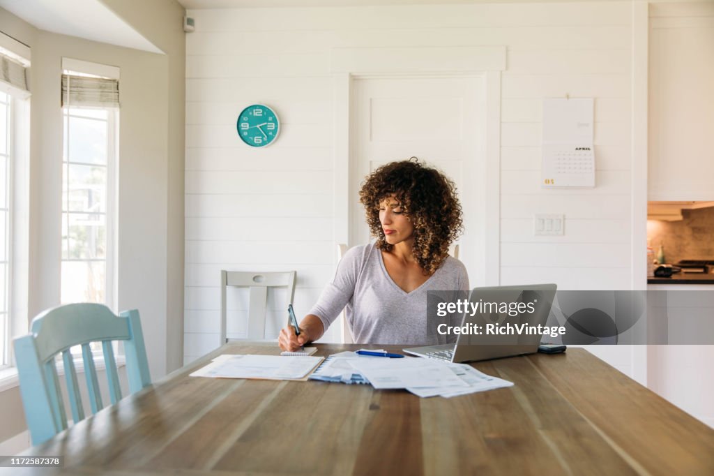 Woman Doing Finances at Home